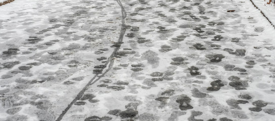 Footsteps in the snow ion city street New York City