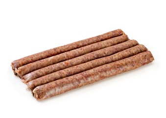 Raw meat sausages on white background