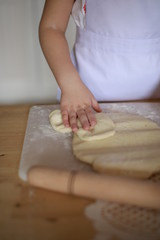 Obraz na płótnie Canvas hands making dough cakes, pizza in the kitchen