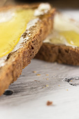 Pieces of bread with butter and honey, macro