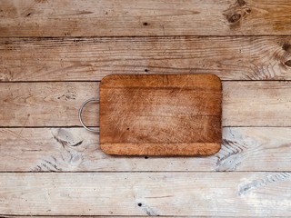 Handmade wooden cutting Board on grey parquet