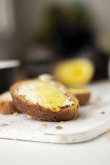 Pieces of bread with butter and honey, macro