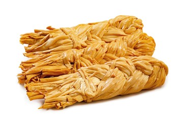 Smoked pigtail cheese on a white background