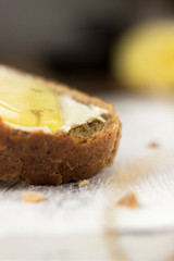 Pieces of bread with butter and honey, macro