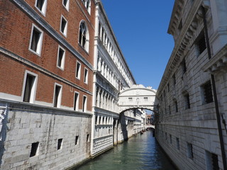Fototapeta na wymiar Exquisite historic stone architecture of Venice, approximately, of Sunny Italy.