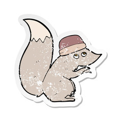 retro distressed sticker of a cartoon squirrel wearing hat
