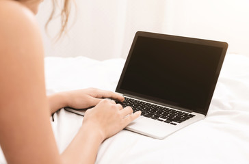 Fototapeta premium Woman using mobile smartphone with blank screen