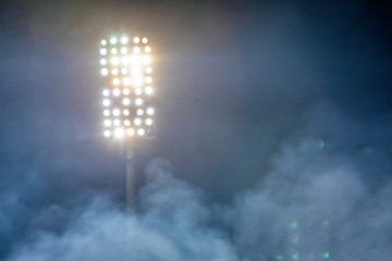 stadium lights and smoke