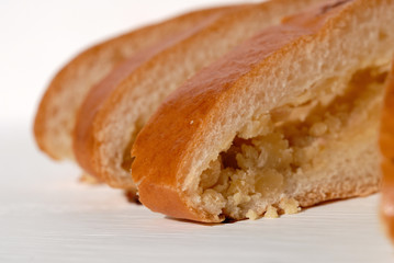 Pie stuffed with peas cut into pieces closeup. Shallow depth of field