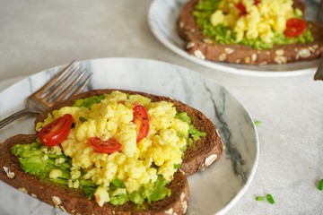 Avocado egg toast with brown bread / Healthy breakfast concept