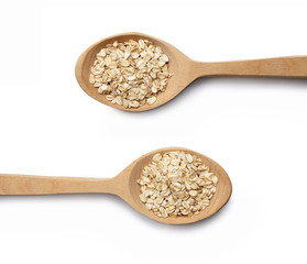 Wooden spoon with oat-flakes cut out. Top view.