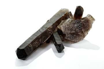 Macro mineral stone smoky quartz, rauchtopaz on a white background