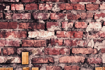 Background from old shabby bare bricks close up