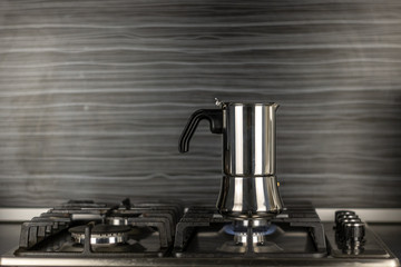 Geyser coffee maker from aluminum on the stove
