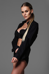 blond woman in lingerie and black shirt posing