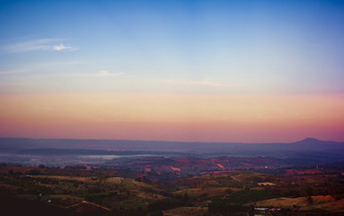 Travel and landscape in summer concept from panorama view of tropical forest with layer of mountain and blue sky background