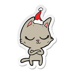 calm sticker cartoon of a cat wearing santa hat