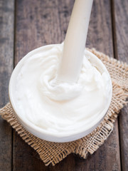 Homemade natural organic body butter in a mortar with pestle.