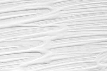 Texture of white color with patterns of divorces and strips painted by paints. Background for a holiday card.