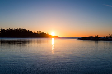 sunrise over tranquil water with reflection
