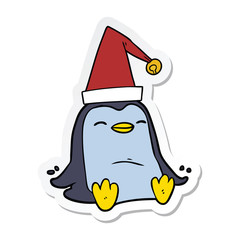 sticker of a cartoon penguin wearing christmas hat