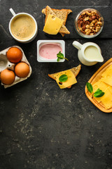 Fototapeta na wymiar breakfast or snack (coffee, yogurt, cheese, sandwiches, cornflakes and more). Food background