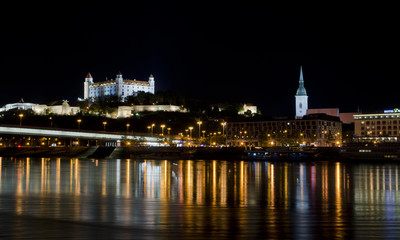 Fototapeta na wymiar City at night, castle on the hill and river, Bratislava, Slovakia