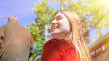 Young woman exits from subway station