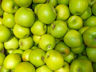 ripe fresh green apples piled up