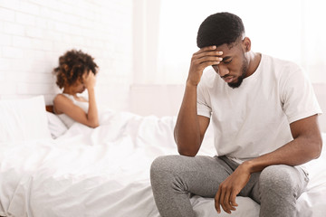 Young couple in bed having problems and crisis