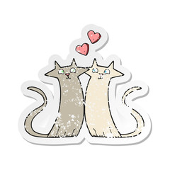 retro distressed sticker of a cartoon cats in love