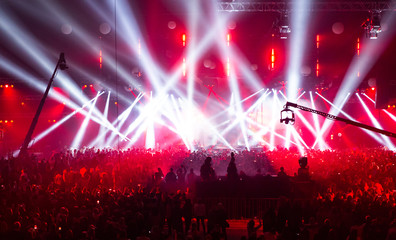 Stage illuminated by beautiful rays of lighting equipment.