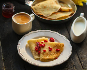 pancakes crepes fritters with raspberries (pancakes with filling) Maslenitsa. food background. top view