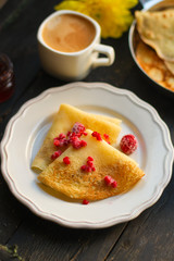 pancakes crepes fritters with raspberries (pancakes with filling) Maslenitsa. food background. top view