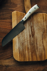 Chef's knife on a wooden board