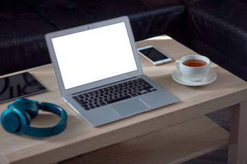 The workplace of a woman with a laptop and a cup of tea