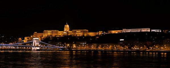 Fototapeta na wymiar Panoramic landscape of Budapest with the Chain Bridge, Buda Castle, Presidental Palace and the Carmelite Monastery by night