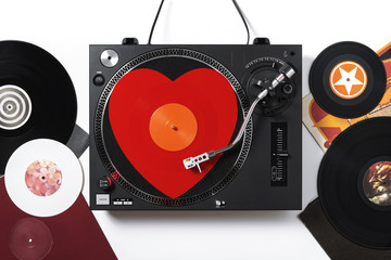 Varna, Bulgaria, January 2019, turntable Numark: Top view of a turntable with red heart-shaped...