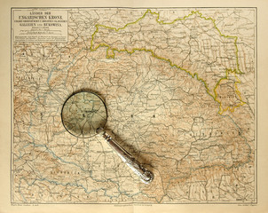 Old map of Hungarian Empire with magnifying glass