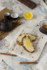 Pieces of bread with butter and honey
