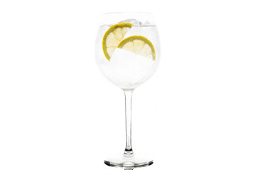 Gin based cocktail in wine glass isolated on white background. Selective focus. Shallow depth of field.