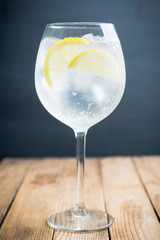 Gin based cocktail in wine glass. Selective focus. Shallow depth of field.