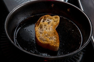 the toast is fried in butter in a pan