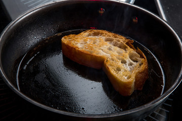 the toast is fried in butter in a pan
