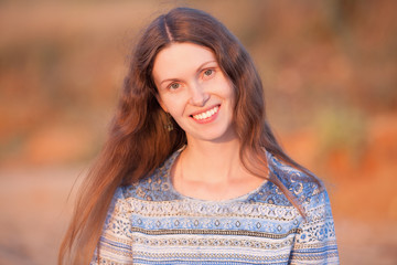 Naklejka premium beautiful girl smiling portrait in nature