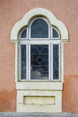 Fototapeta na wymiar Old painted window with ornaments
