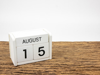 August 15 white cube wooden calendar on vintage wood and white background with summer day,...