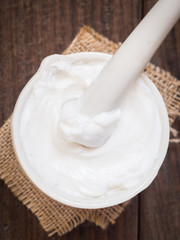 Homemade all natural body butter in mortar. Overhead view.