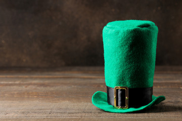 St.Patrick 's Day. celebration. Green hat of a leprechaun on a brown background. space for text