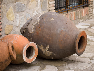 Qvevri (kvevri), a large earthenware vessel originally from Georgia, Caucasus, used for the fermentation and storage of wine, often buried below ground level or set into the floors of wine cellars.